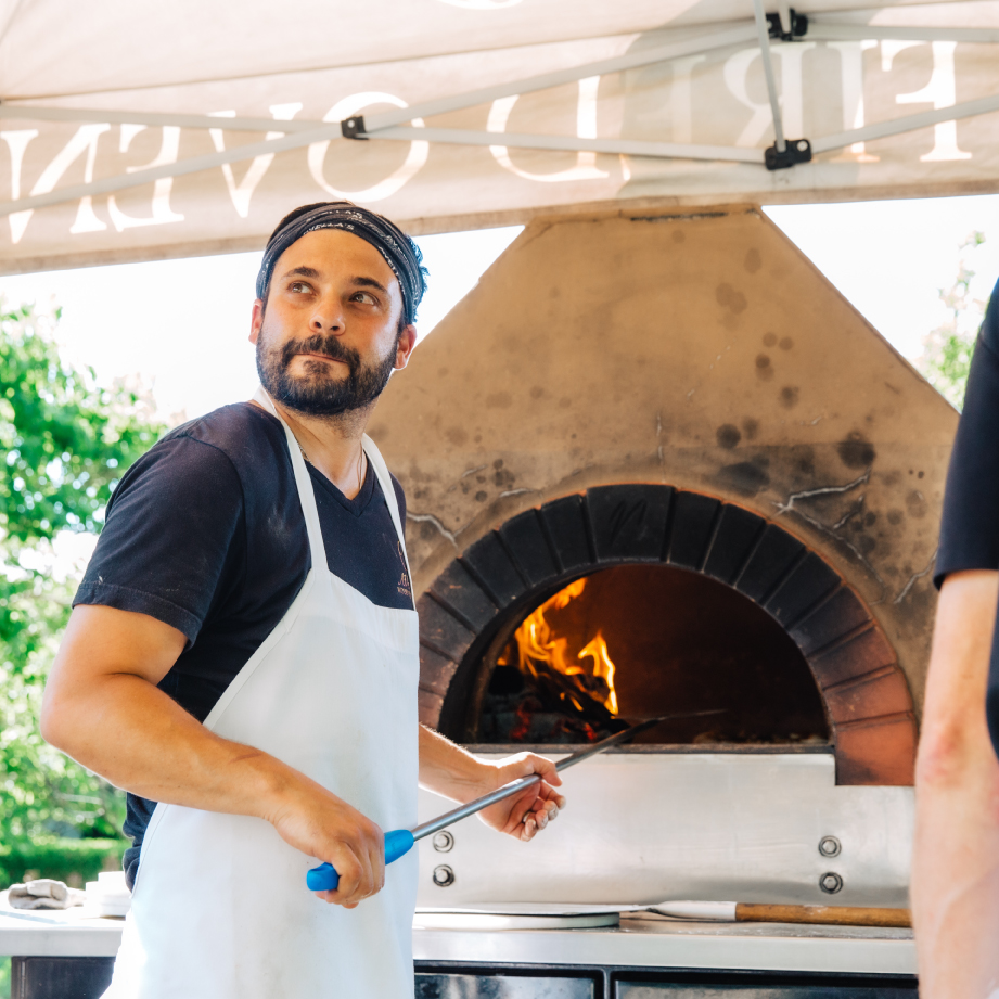 Avella, Vito infront of pizza oven